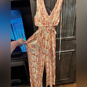 Cream and Orange Flowy Jumpsuit with V-Neckline